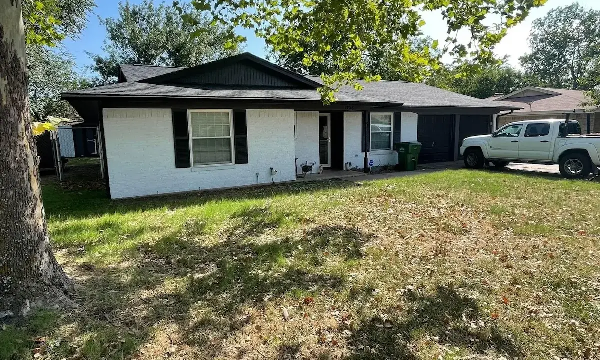 Professional roofing crew working on a residential roof in Aspen